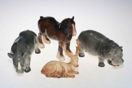 Melba Pottery hippo and rhino, together with Beswick shire and stag (4).
