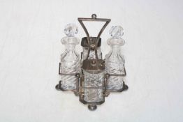 Late Victorian silver four bottle cruet, Sheffield 1891, having two silver mounted bottles,
