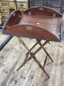 Mahogany butlers tray on folding turned leg stand.