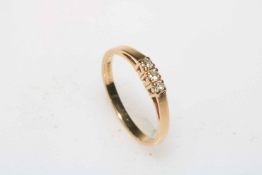 Diamond three stone 9 carat gold ring, size O.