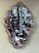 Venetian style marginal wall mirror with applied coloured glass and floral frame, 78cm by 58cm.