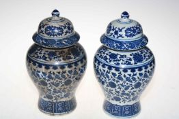 Pair Chinese blue and white baluster vases and covers, 30cm.