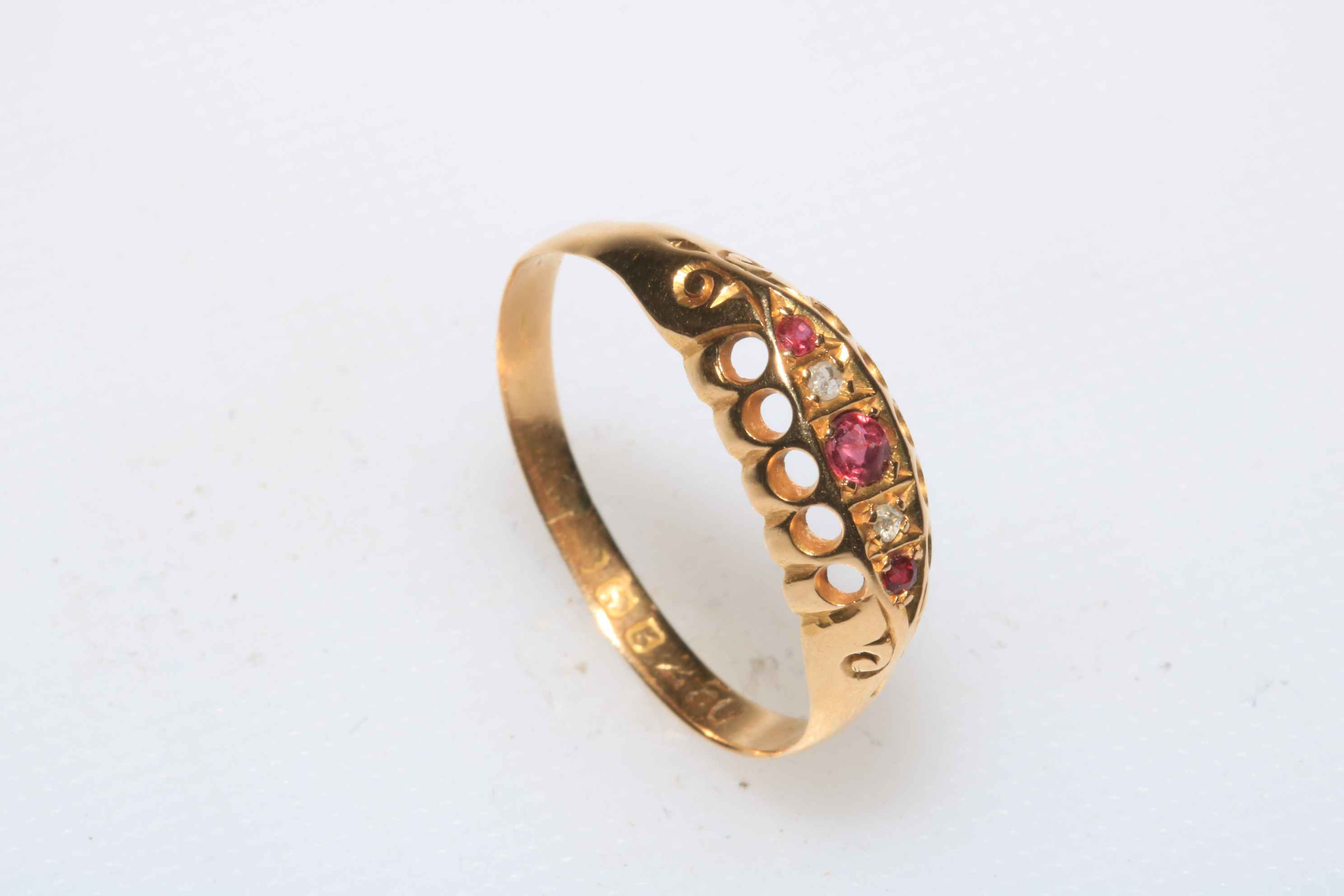 Ruby and diamond 18 carat gold ring, size R.
