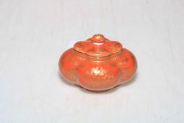 Chinese red glazed ink box with gilt decoration, Qianlong mark to base, 5cm high.