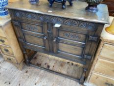 Carved oak two door side cabinet, 91cm by 92cm by 40.5cm.