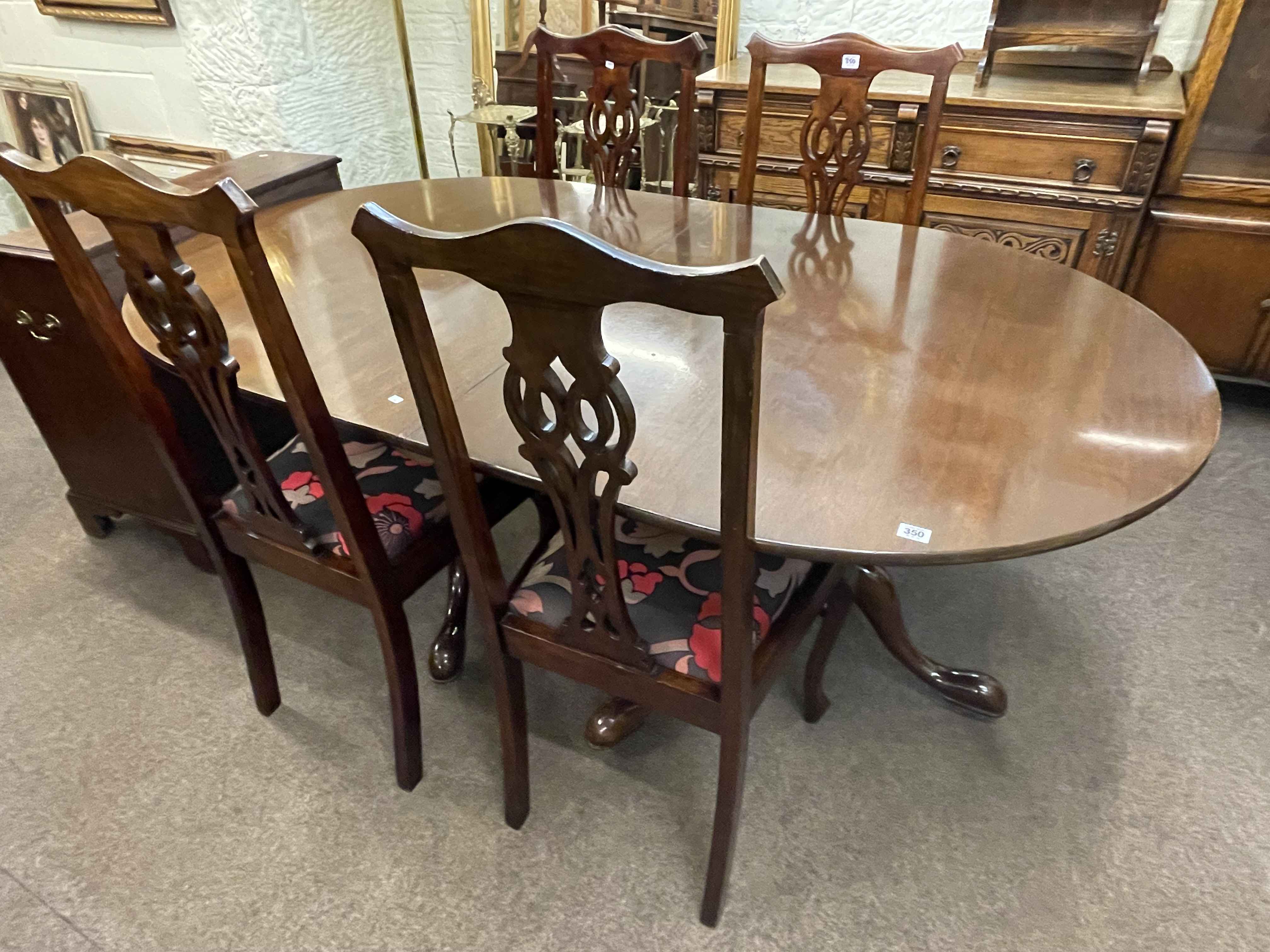 Mahogany twin pedestal extending dining table and leaf together with a set of four Chippendale