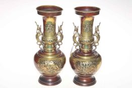 Pair large Oriental metal vases with creature handles and relief decoration, 35cm.
