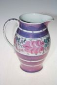 Large Grays Pottery purple and floral design lustre jug, 30cm.