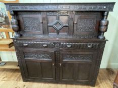 Antique carved oak court cupboard, 101.5cm by 164.5cm by 57cm.
