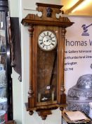 Victorian walnut cased double weight Vienna wall clock, 113cm by 49cm.