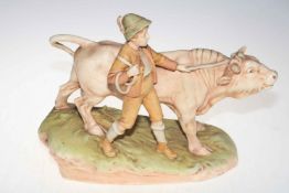 Continental Royal Dux style boy with bull group, printed mark, 39cm wide, 29cm high.