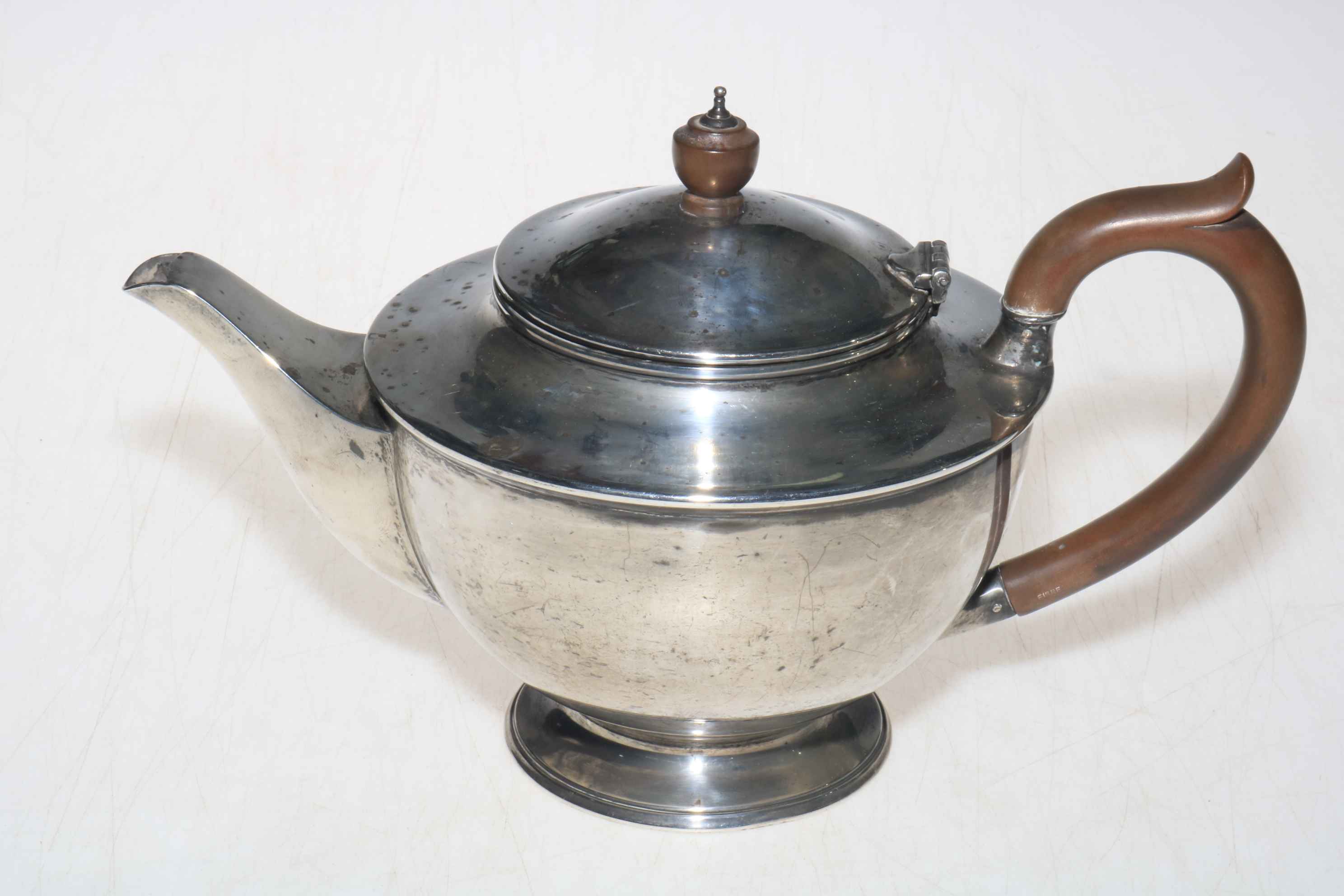 Silver teapot with plain circular body, 15.5cm high, London 1945.
