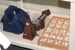 Collection of thimbles, metronome, aneroid barometer and set of wood bowls with bag.