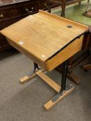 Child's slope front school desk, 79cm by 57cm by 46cm.