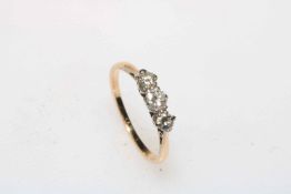 Three stone diamond gold ring, tests as 18 carat, size L.