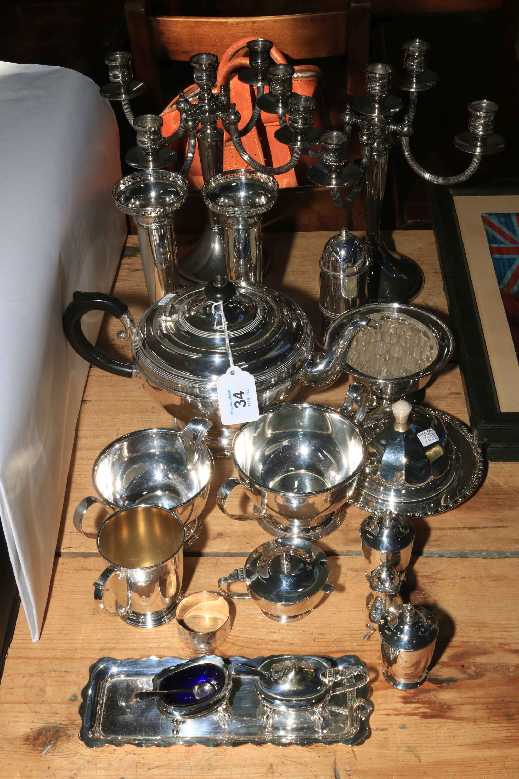 Silver plated wares including pair five light candelabra, tea set, cruets, etc.