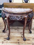 Oriental hardwood and mother of pearl inlaid demi-lune table with marble inset top on ball and claw