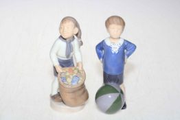 Two Royal Copenhagen figures, boy with sack 4534 and boy with beach ball 3542, 16.5cm.