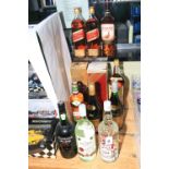 Twelve bottles of spirits including Johnnie Walker 1 litre, Bell's Whisky 1.