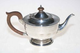 Silver teapot with panelled circular body, 14cm high, Birmingham 1931.