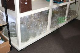 Large collection of glassware including decanters, carafes, dishes, etc.