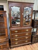 Walnut secretaire bookcase having two mirror panelled doors above a secretaire drawer with three
