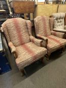 Early 20th Century pair wing armchairs, the arms terminating with carved eagle heads on claw legs.