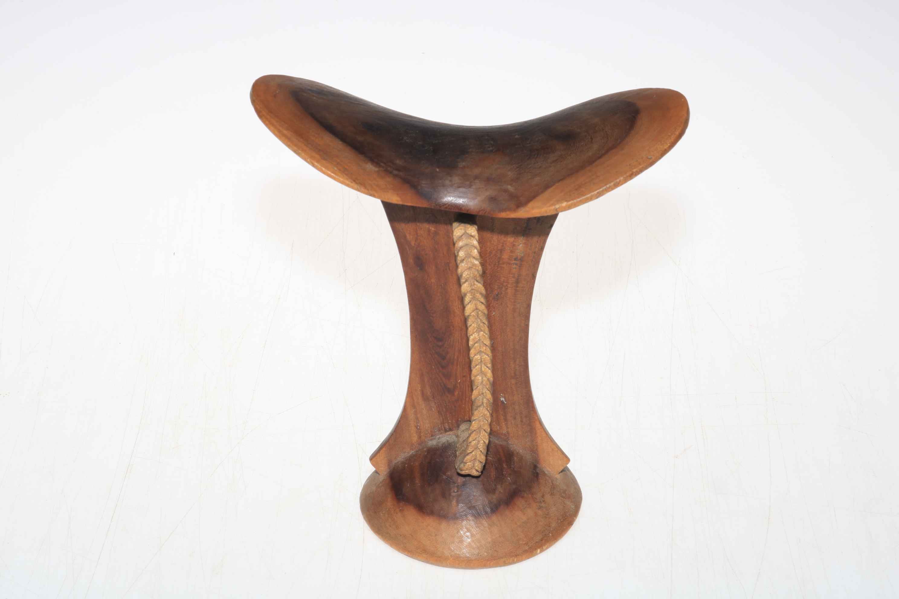 African carved wood headrest with woven handle, 19.5cm high.