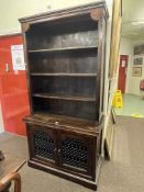 Hardwood cabinet having shelved top above two metalwork panelled doors, 197cm by 100cm by 49cm.