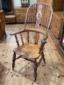 Antique yew broadarm Windsor chair with pierced splat back.
