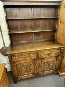 Carved oak shelf back dresser, 185cm by 127cm by 48cm.