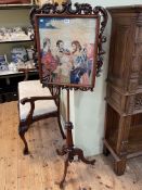 Victorian mahogany tripod pole screen with glazed religious woolwork panel, 161cm.