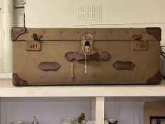 Vintage canvas and leather bound travelling trunk, 36cm by 91cm by 51cm.