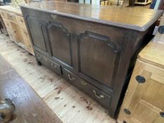 Antique oak triple fielded panel front two drawer mule chest, 92cm by 150cm by 53cm.