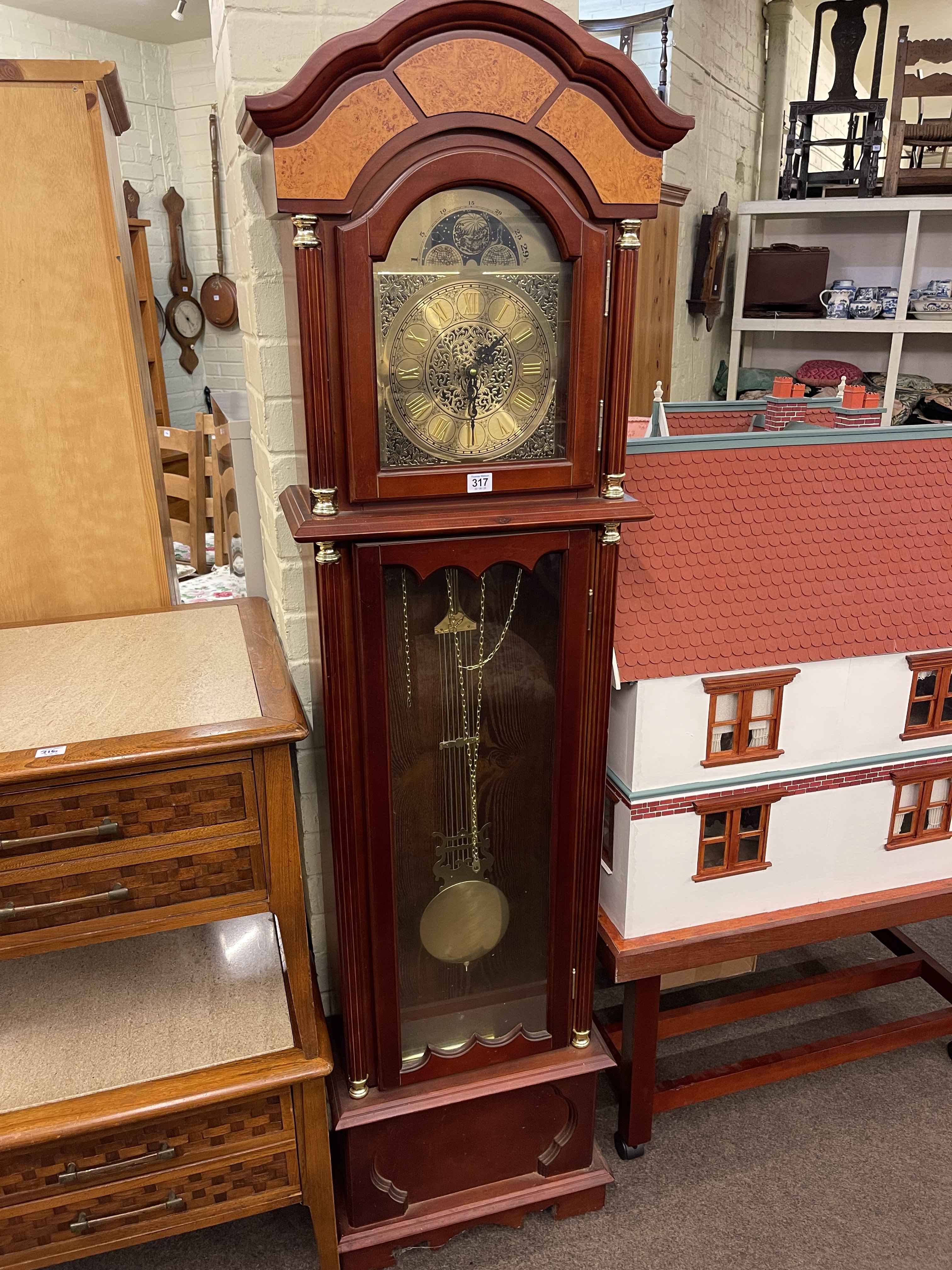 Modern double weight longcase clock having arched dial.
