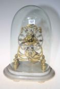 Brass skeleton clock under glass dome, 44cm high.