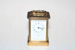 Gilt brass carriage clock, the face signed by retailer Matthew Norman, London.