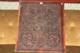 Carved Victorian mahogany panel with lion heads, fruit and flower decoration, 72cm high.