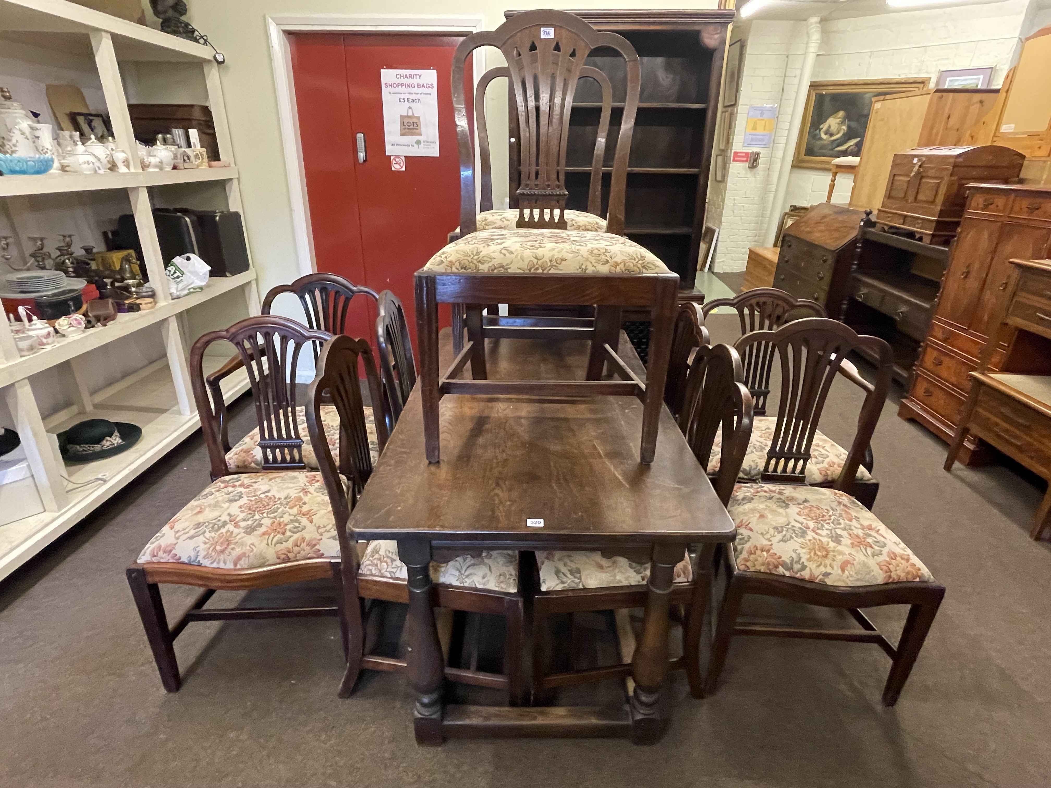 Oak refectory table and ten Georgian mahogany dining chairs (5x5).
