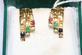 Pair 18 carat gold earrings set with emerald, ruby and sapphire.