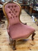 Victorian mahogany framed spoon back nursing chair in rose pink buttoned draylon.