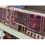Collection of six various Persian design rugs (largest 1.80 by 0.78).