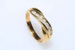 18 carat gold seven stone diamond ring, size T.