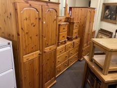 Pine nine piece bedroom suite comprising two double door wardrobes, one with two drawers,