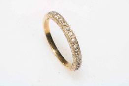 9 carat gold diamond set half eternity ring, size Q.