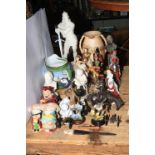 Collection of decorative figurines and porcelain including Royal Doulton, Country Artists,