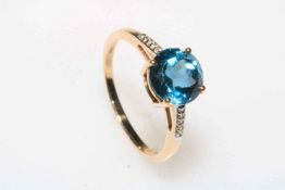 10k gold and blue topaz ring (approx 3 carat), size M.