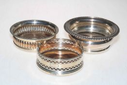 Silver wine bottle coaster Sheffield 1921, and two silver plated coasters (3).