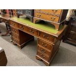 Mahogany eight drawer pedestal desk, 78cm by 123cm by 62cm.