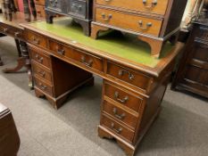 Mahogany eight drawer pedestal desk, 78cm by 123cm by 62cm.